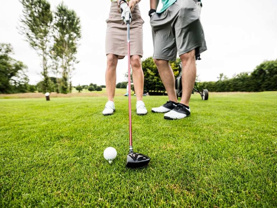 couple playing golf